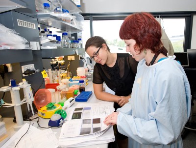 Researcher and businesswoman in a lab